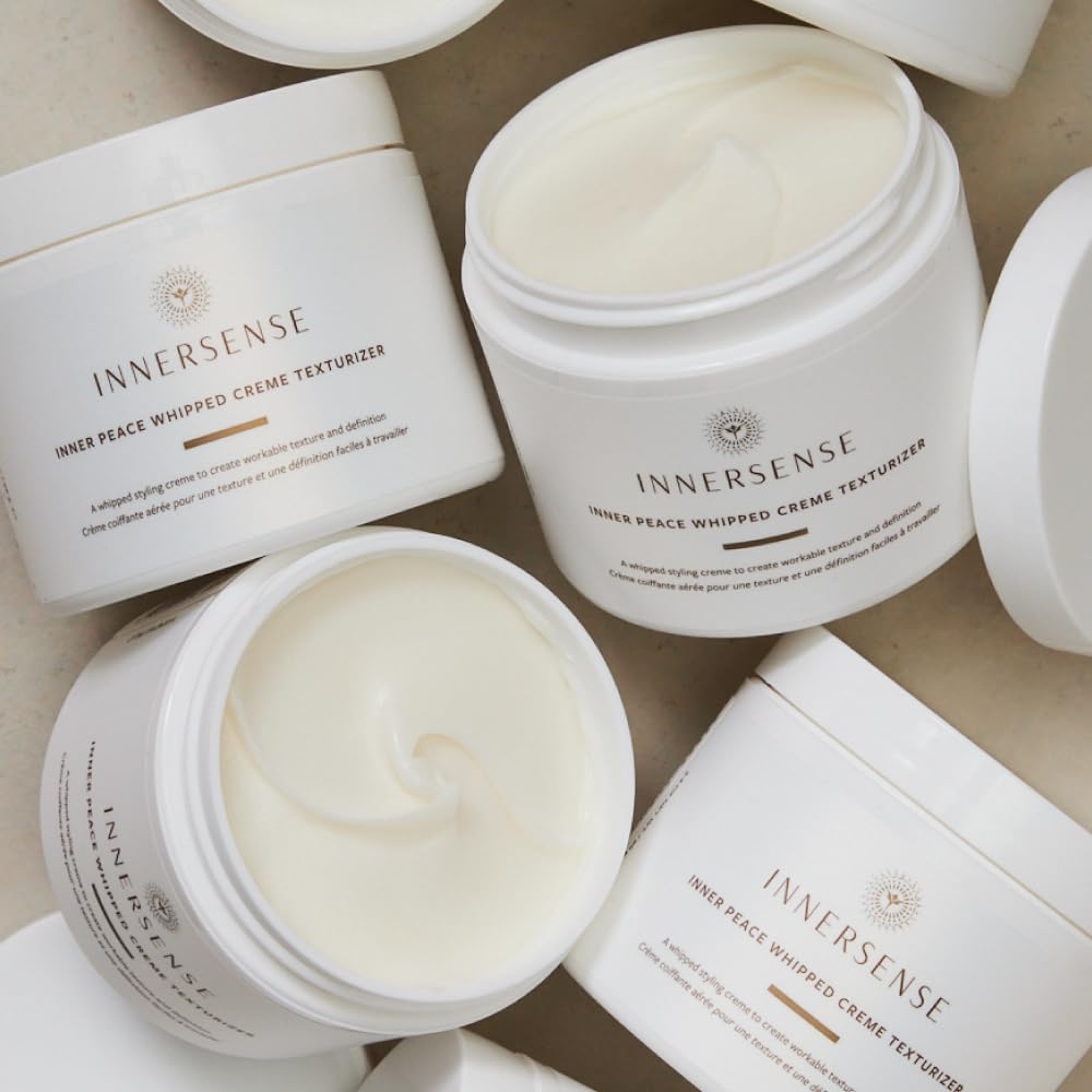 INNERSENSE 3.3oz jar next to a hand to show true size and portable convenience