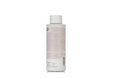 IRALTONE shampoo texture close-up on fingertips showing creamy lather and quick absorption benefit