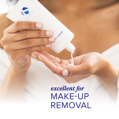 iS CLINICAL cleanser in hand for scale and soft moisturizing benefit