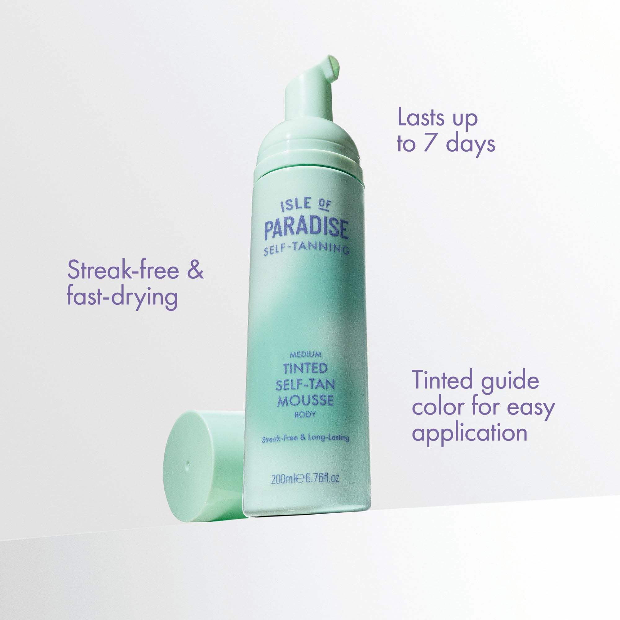 Isle of Paradise mousse being applied by hand illustrating even, streak-free spread