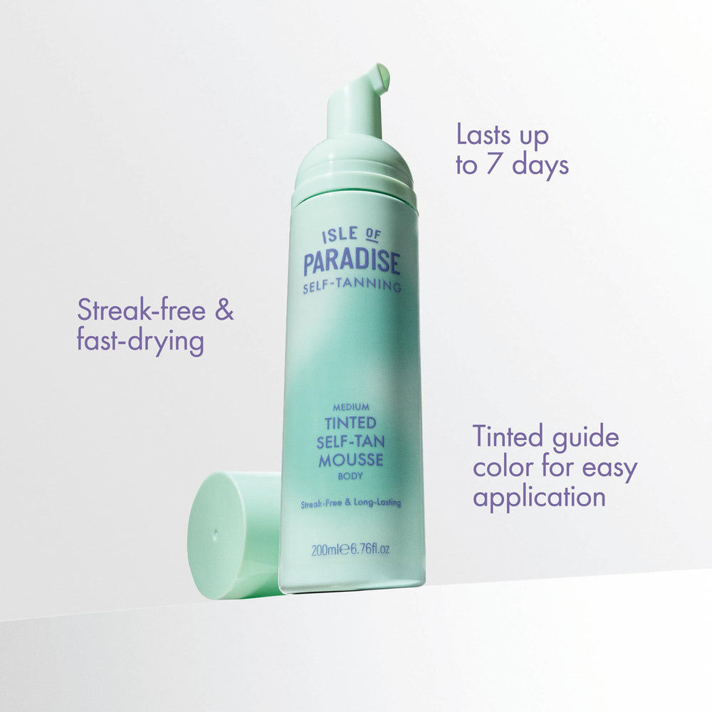 Isle of Paradise mousse being applied by hand illustrating even, streak-free spread