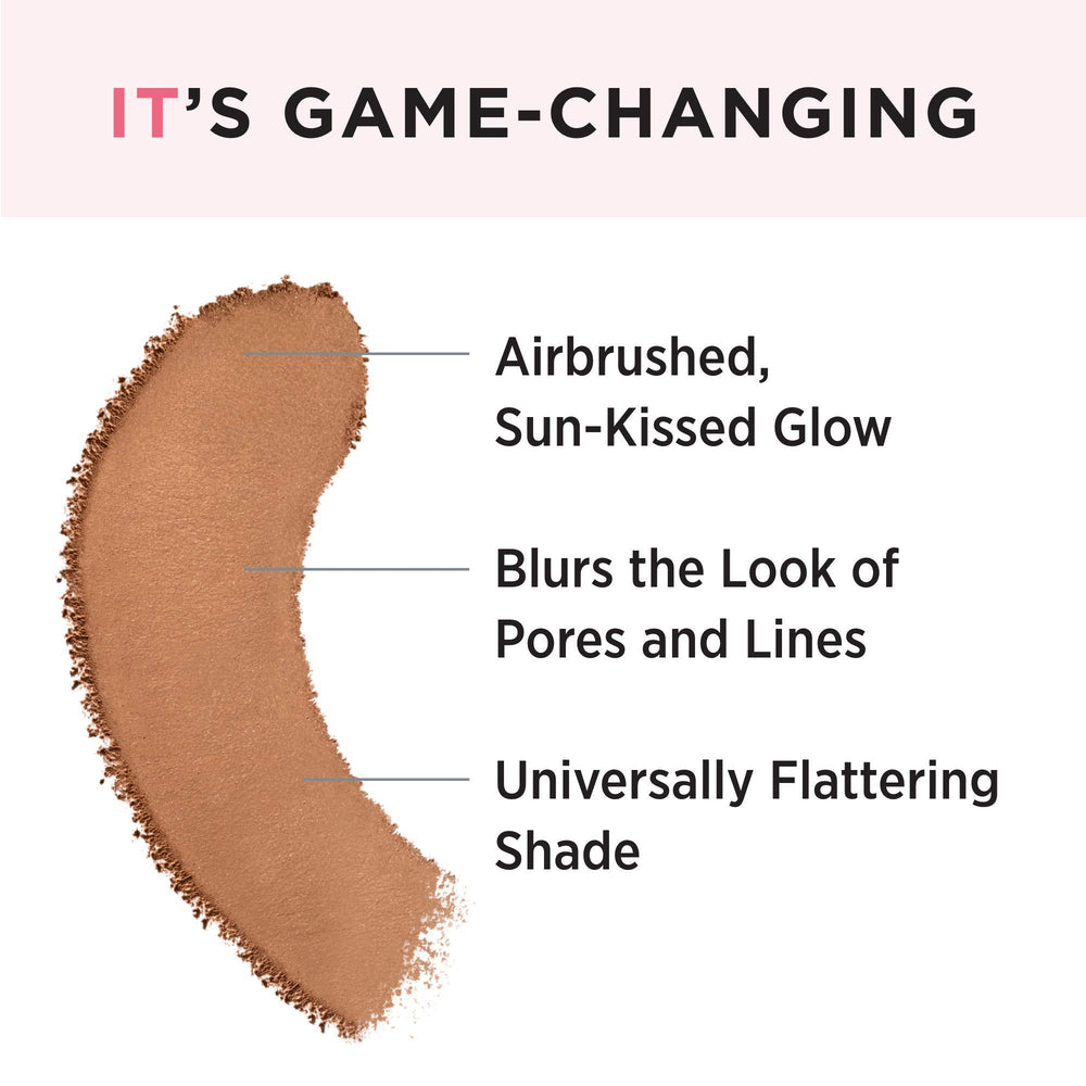Brush applying IT Cosmetics bronzer for even, pore-softening coverage