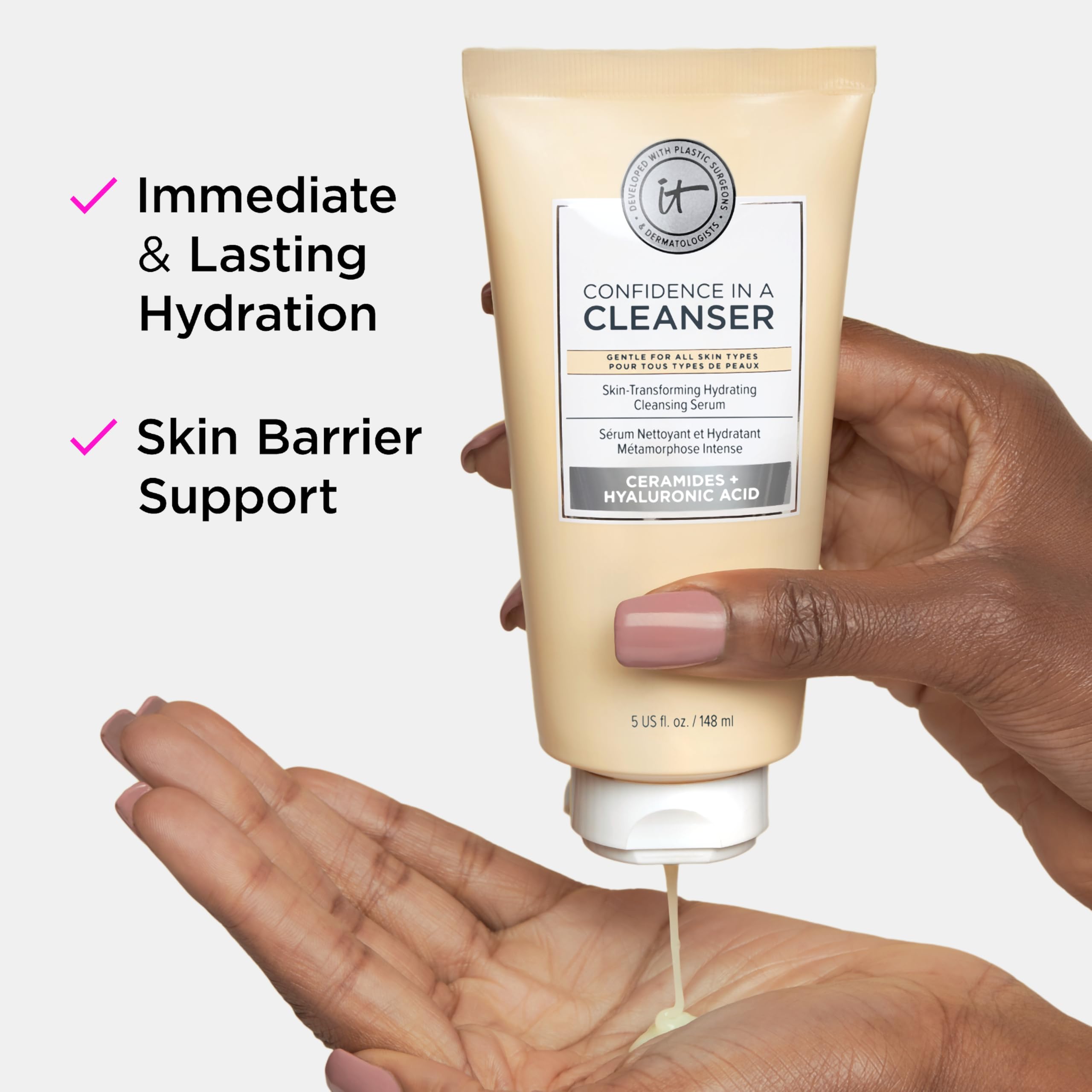 IT Cosmetics mini bottle in hand showing compact size and portability benefit