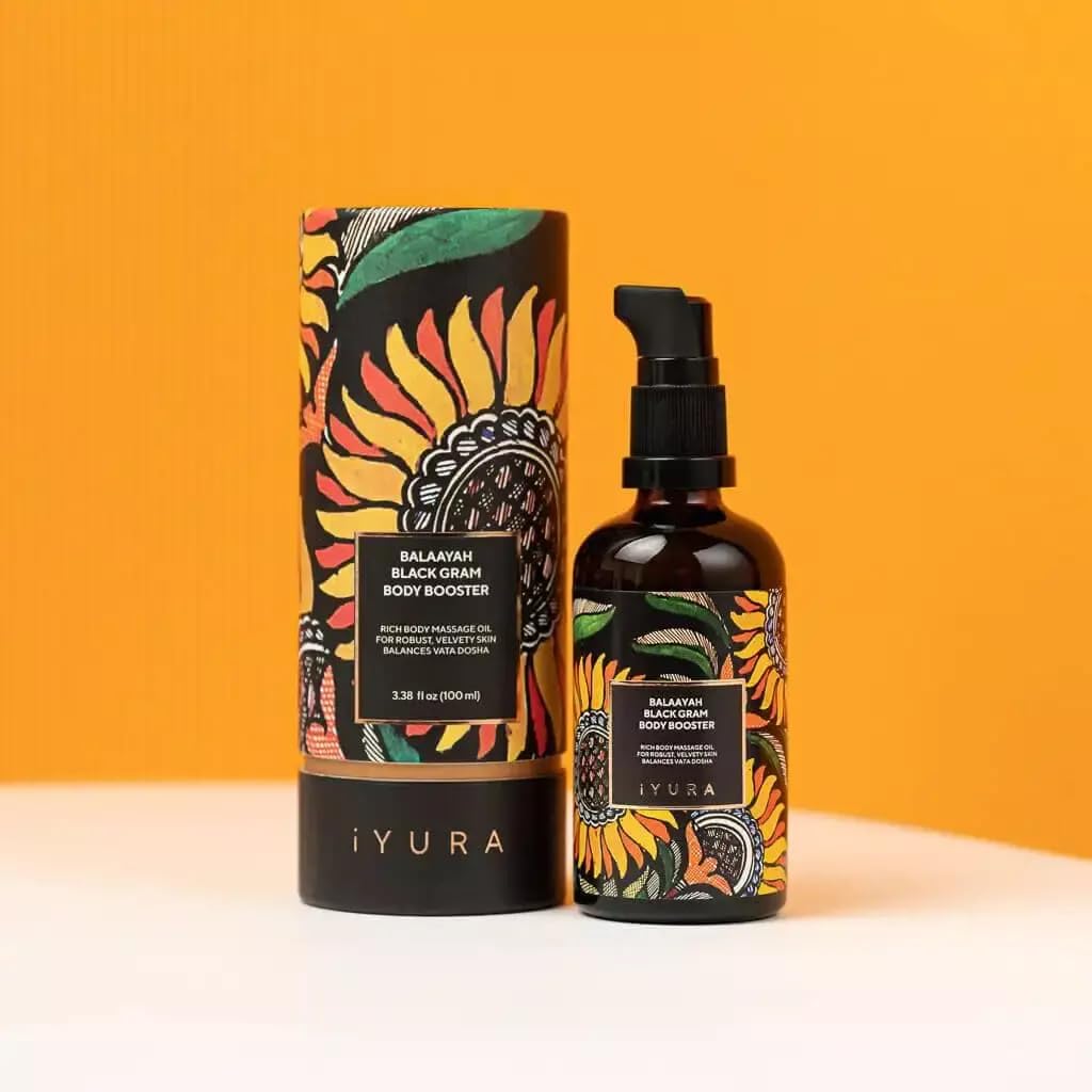 The Ayurveda Experience Balaayah bottle next to a hand for scale and easy dosing benefit