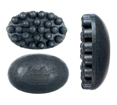 Jack Black charcoal body bar close-up of raised massage nodules to show texture and targeted muscle relief
