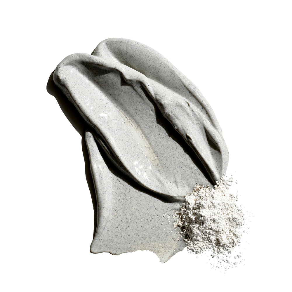 Jack Black product texture on hand revealing clay-rich consistency and exfoliation benefit