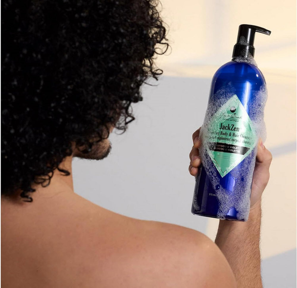 Jack Black cleanser in lifestyle shower scene showing calming ritual and refreshment
