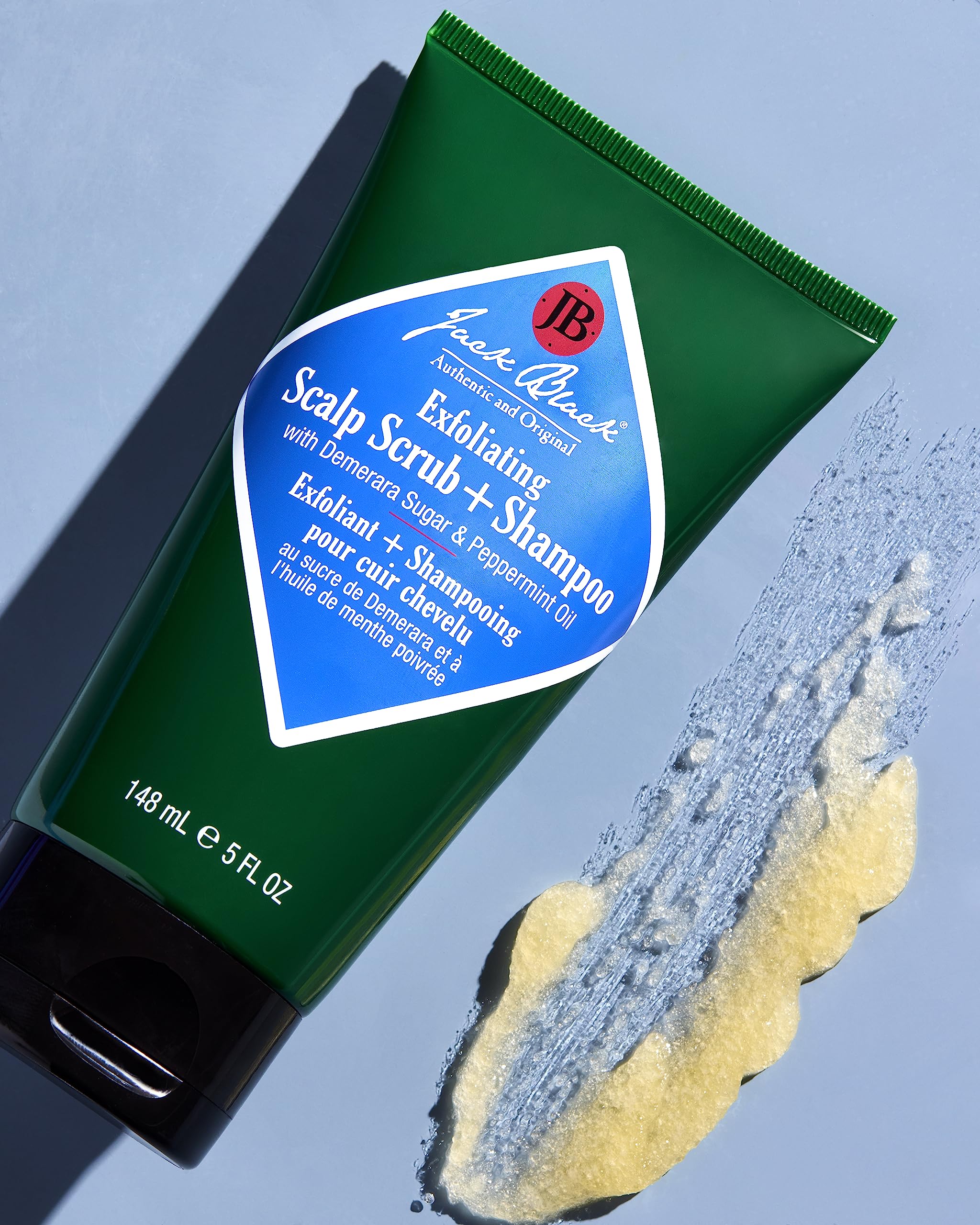 Jack Black demerara sugar texture close-up showing gentle exfoliation action