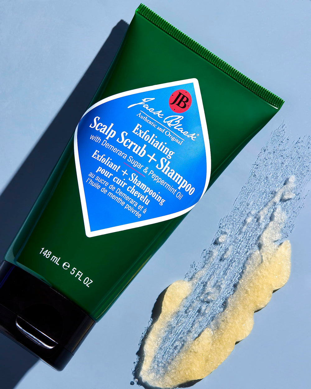 Jack Black demerara sugar texture close-up showing gentle exfoliation action
