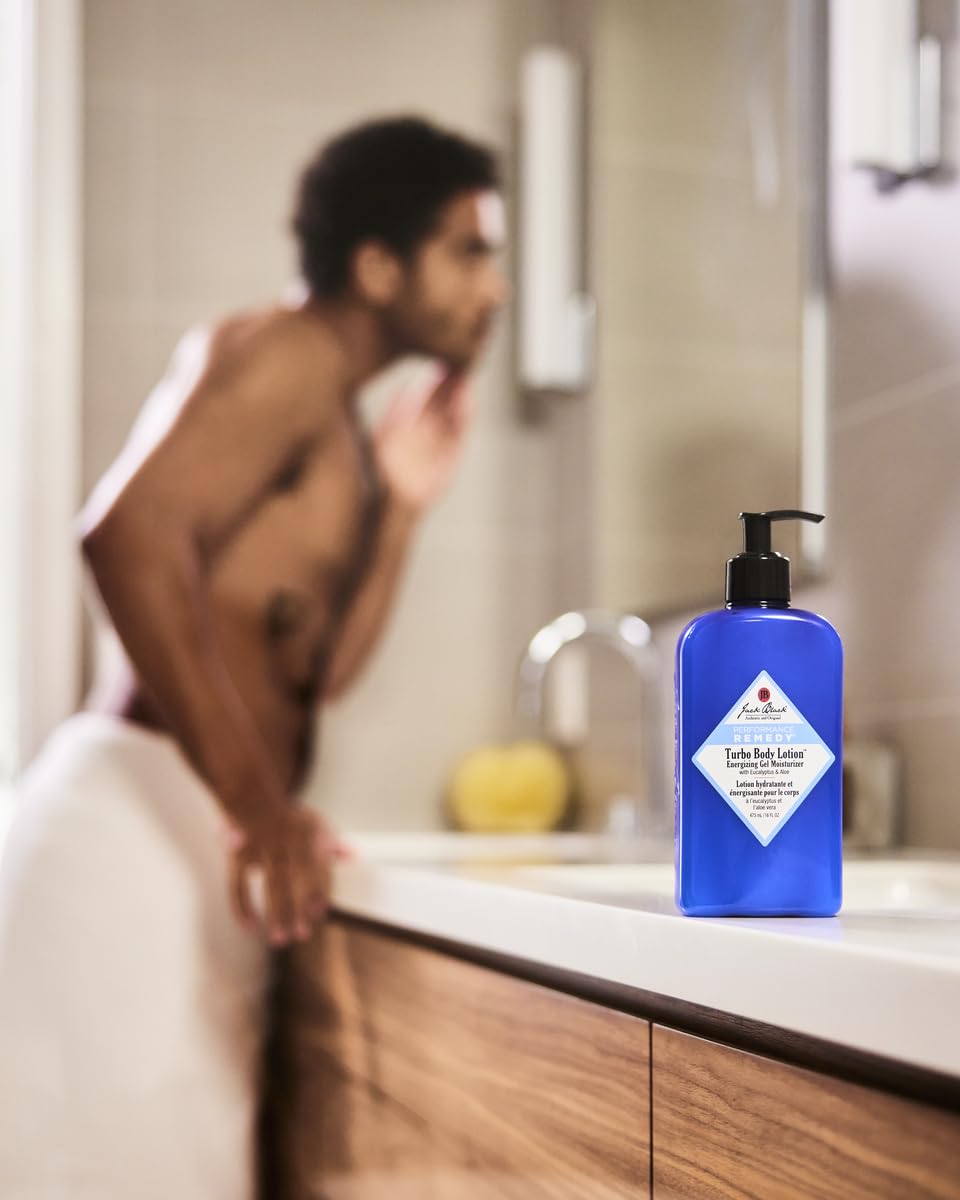 Jack Black tube on bathroom shelf by shower indicating post-shower hydration benefit