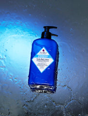Jack Black tube held in hand to show 16 fl oz size and travel-friendly scale
