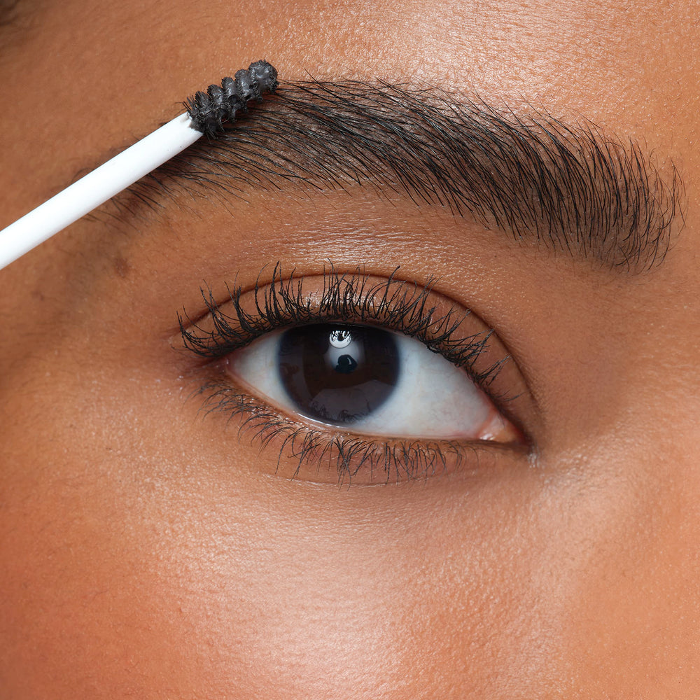 jane iredale PureBrow next to common objects for size comparison and travel convenience