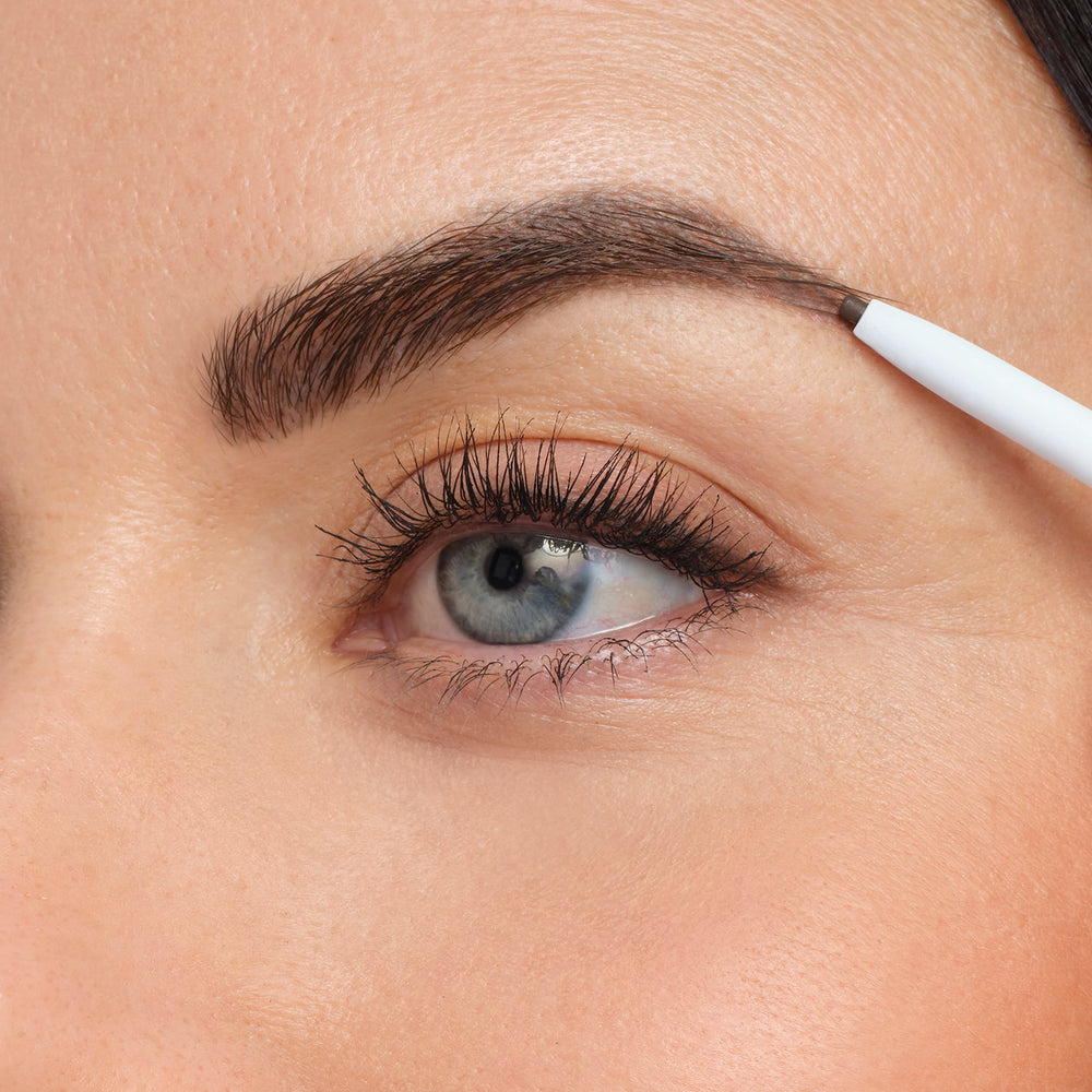 medium brown swatch stroke from jane iredale pencil showing natural blendable color