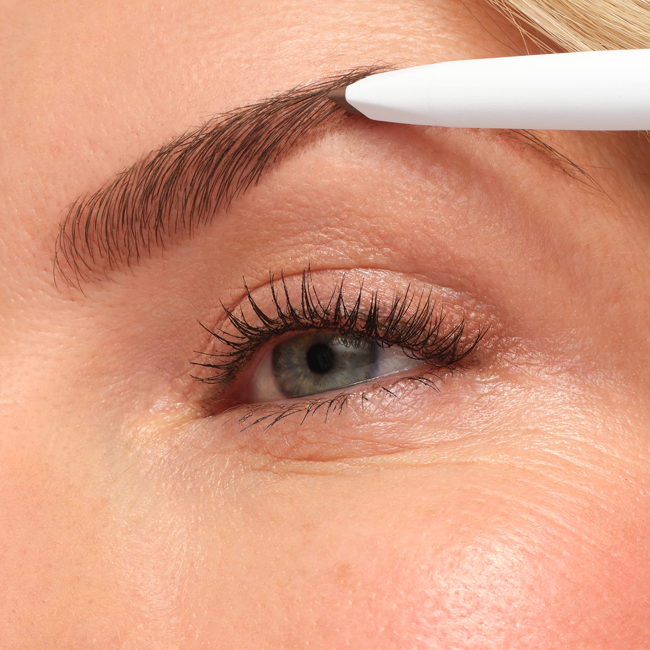 jane iredale PureBrow next to car keys to illustrate compact size and travel convenience