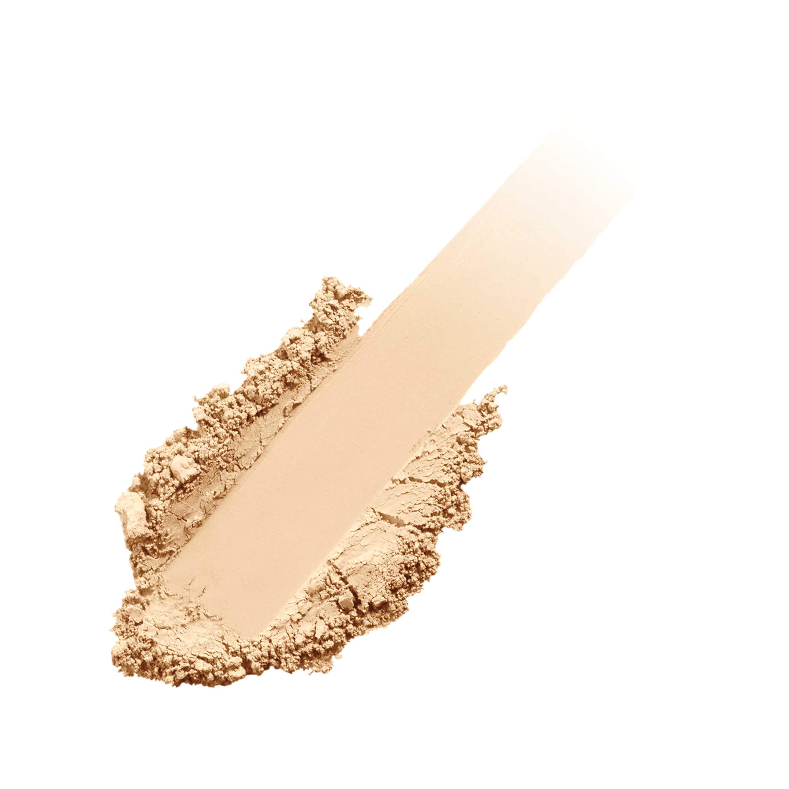 jane iredale refill beside coin to show pan size and refill portability