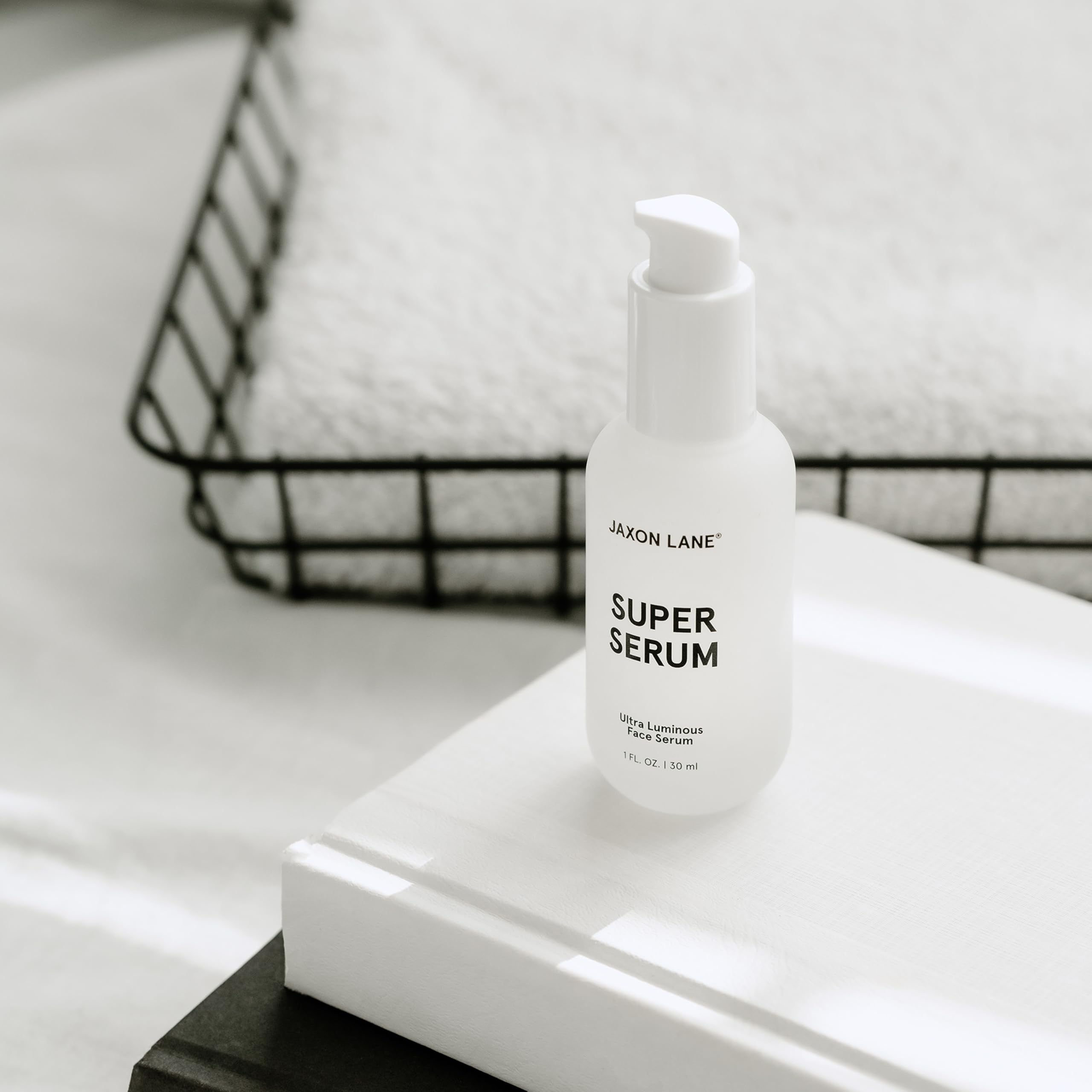 JAXON LANE serum in outdoor scene illustrating daily-use convenience