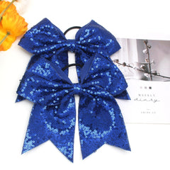 Jeffan bow worn in ponytail demonstrating secure fit and shine