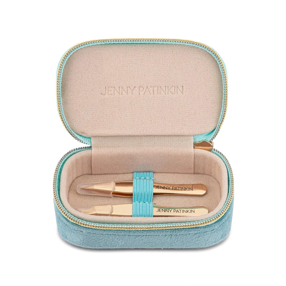 Jenny Patinkin tweezers held in hand showing compact travel-friendly size