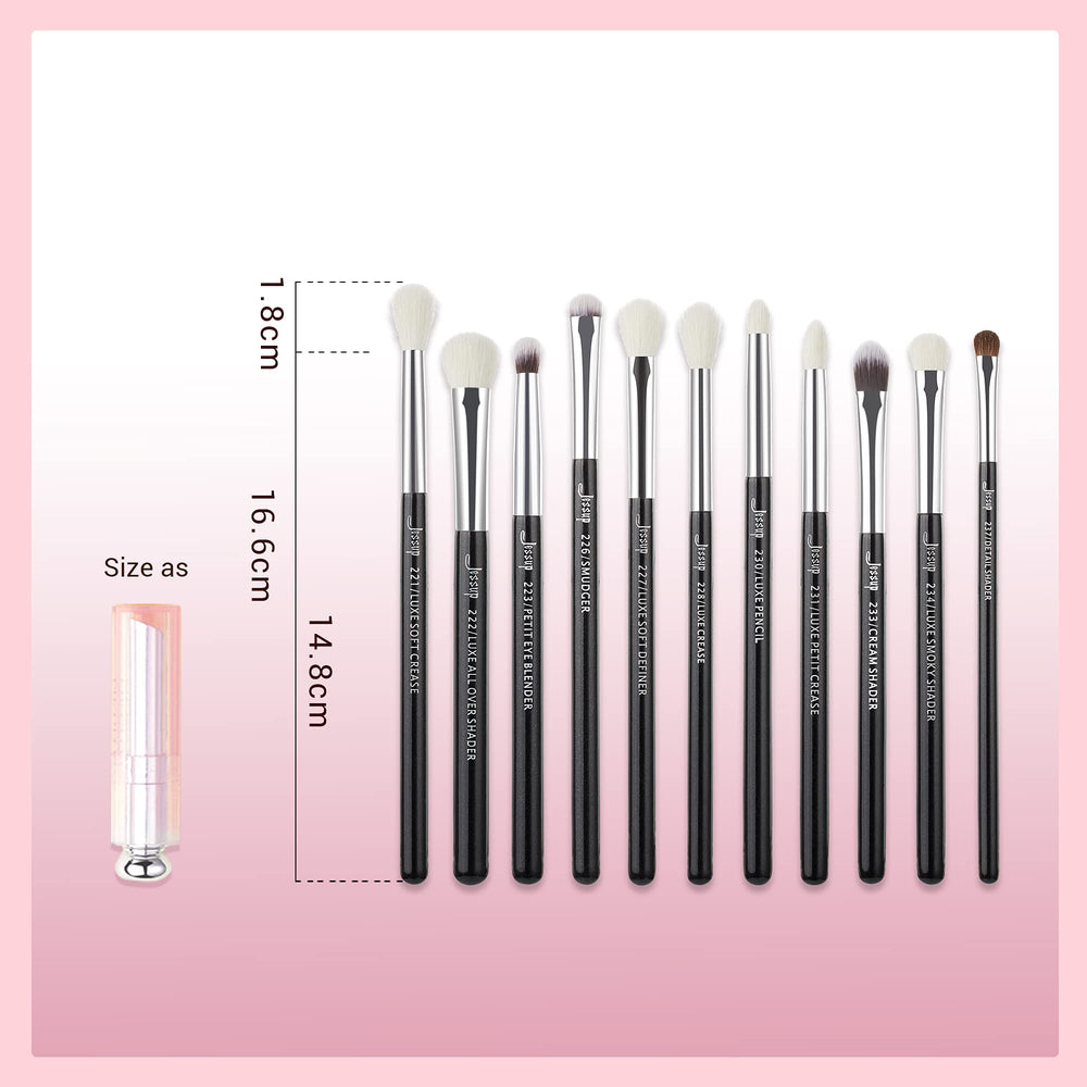 Jessup brushes beside a coin to show compact size and portable professional kit