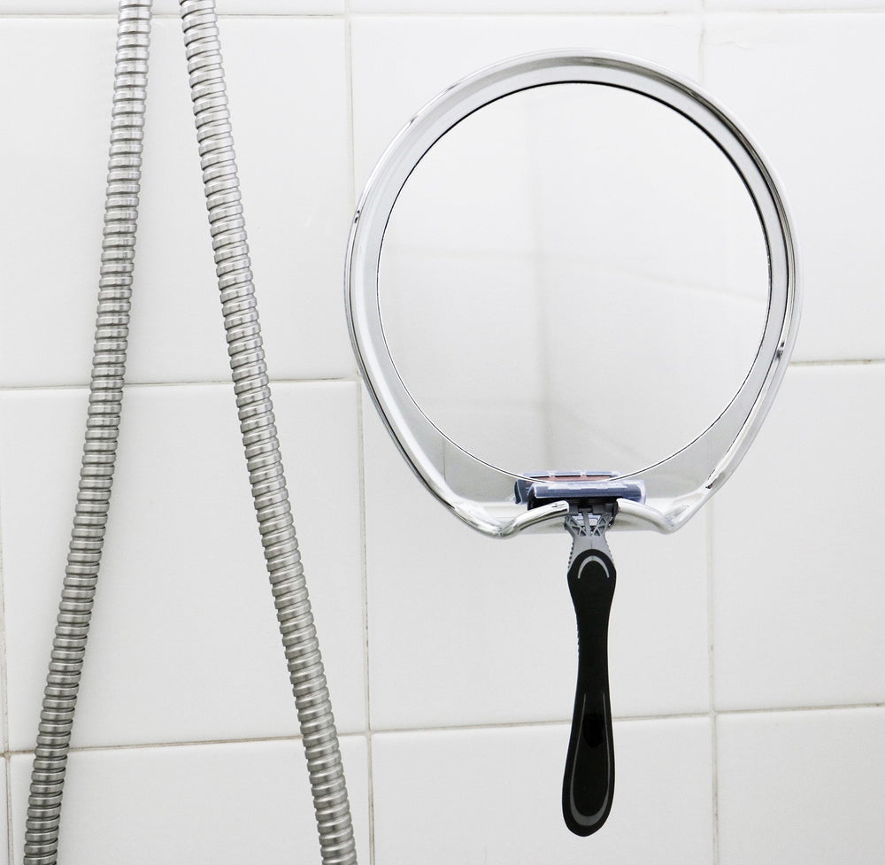 JiBen mirror in shower environment showing fog-free clarity