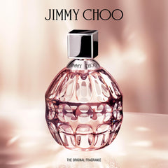 Jimmy Choo lotion held in hand showing 5oz scale and portability benefit