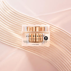 JLO BEAUTY cream spread on hand demonstrating lightweight absorption and glow