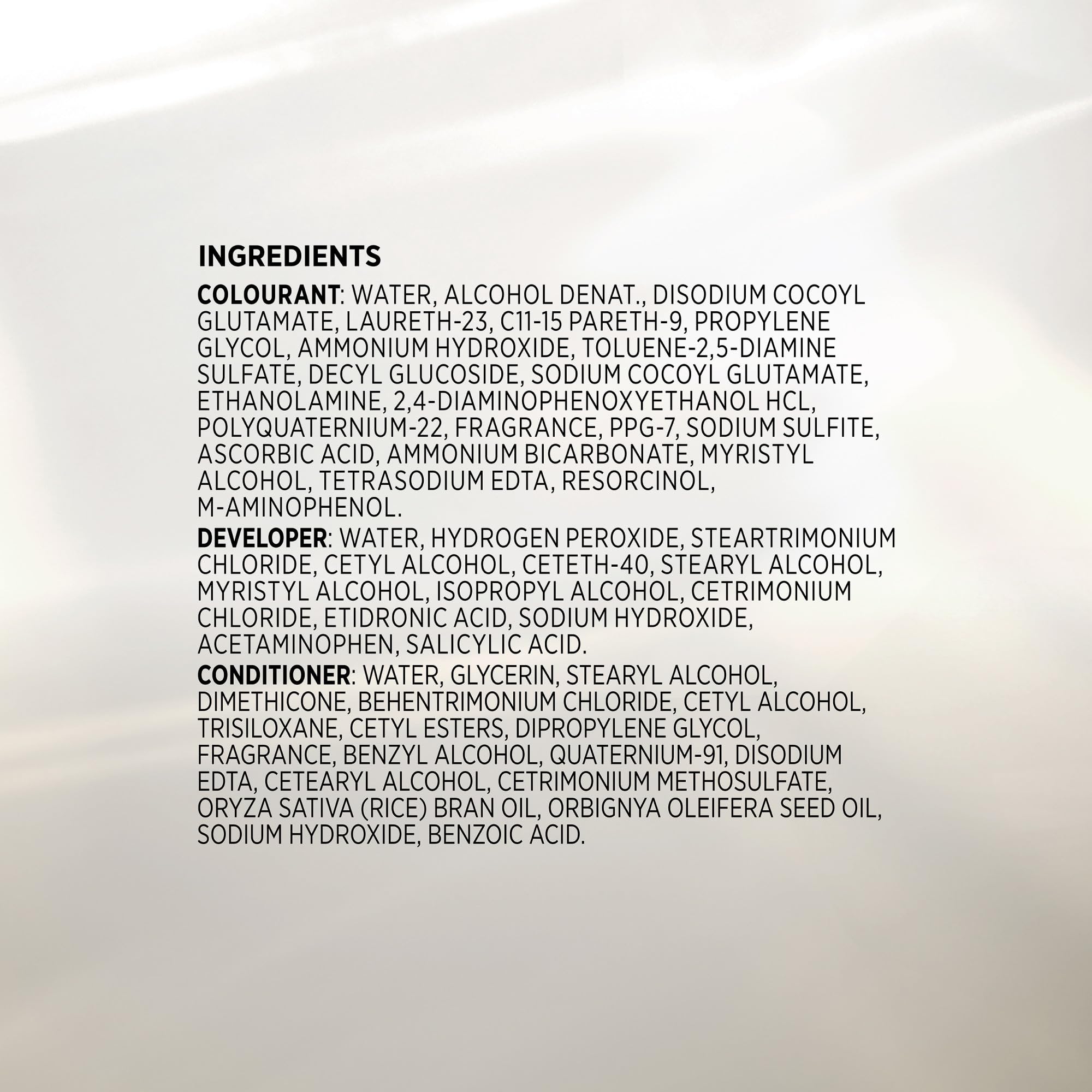 John Frieda foam applied at roots to demonstrate full grey coverage