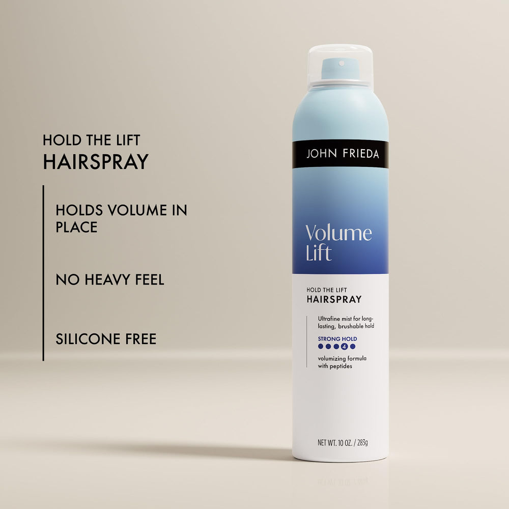 John Frieda mist settling on hair strands to add lightweight texture