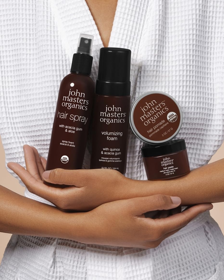 john masters organics scale with 2oz label next to a coin showing travel-friendly size benefit