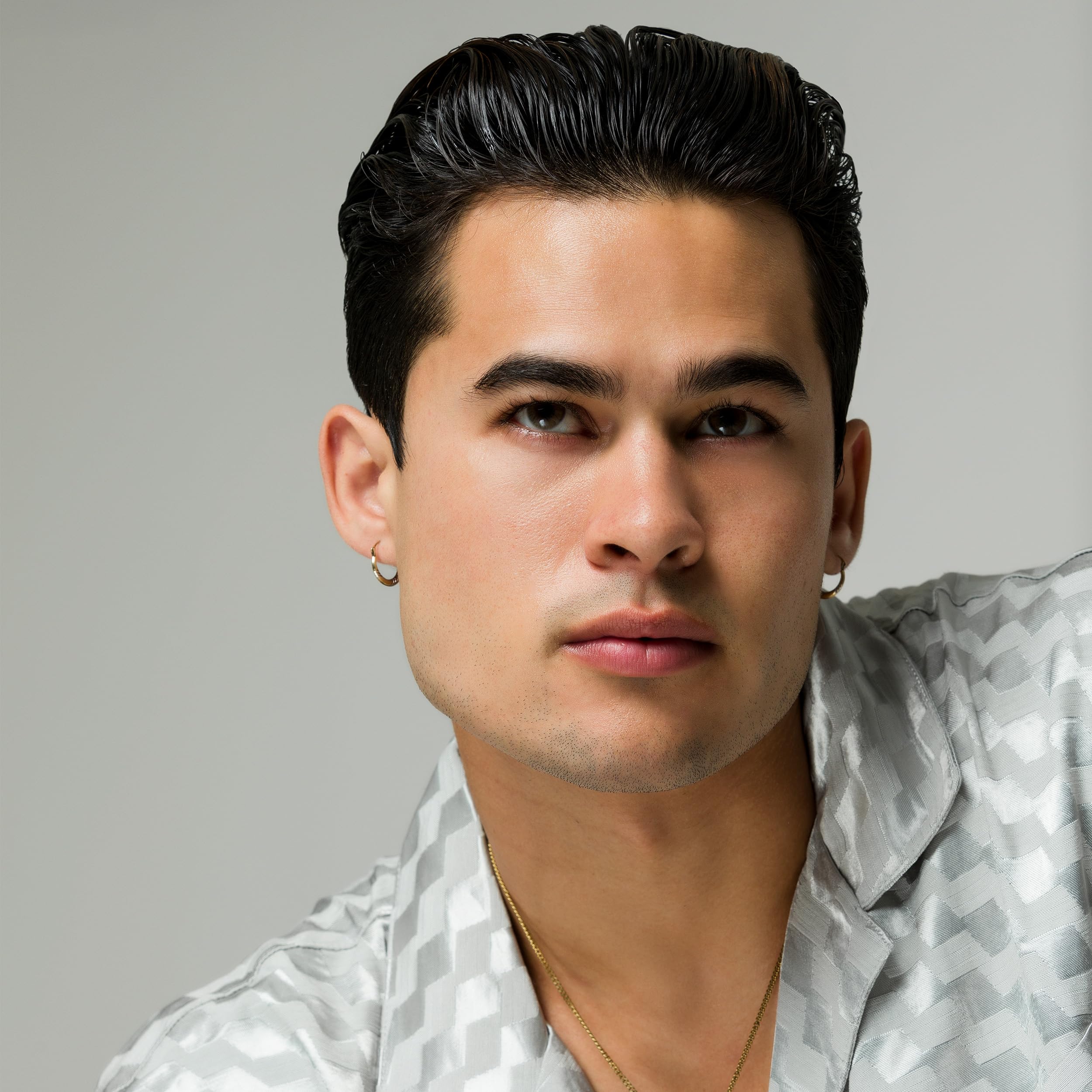 JOHNNY B. applying gel to hair demonstrates easy restyling benefit