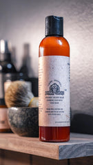 Johnny Slicks bottle in hand showing 8 oz scale for travel-friendly benefit