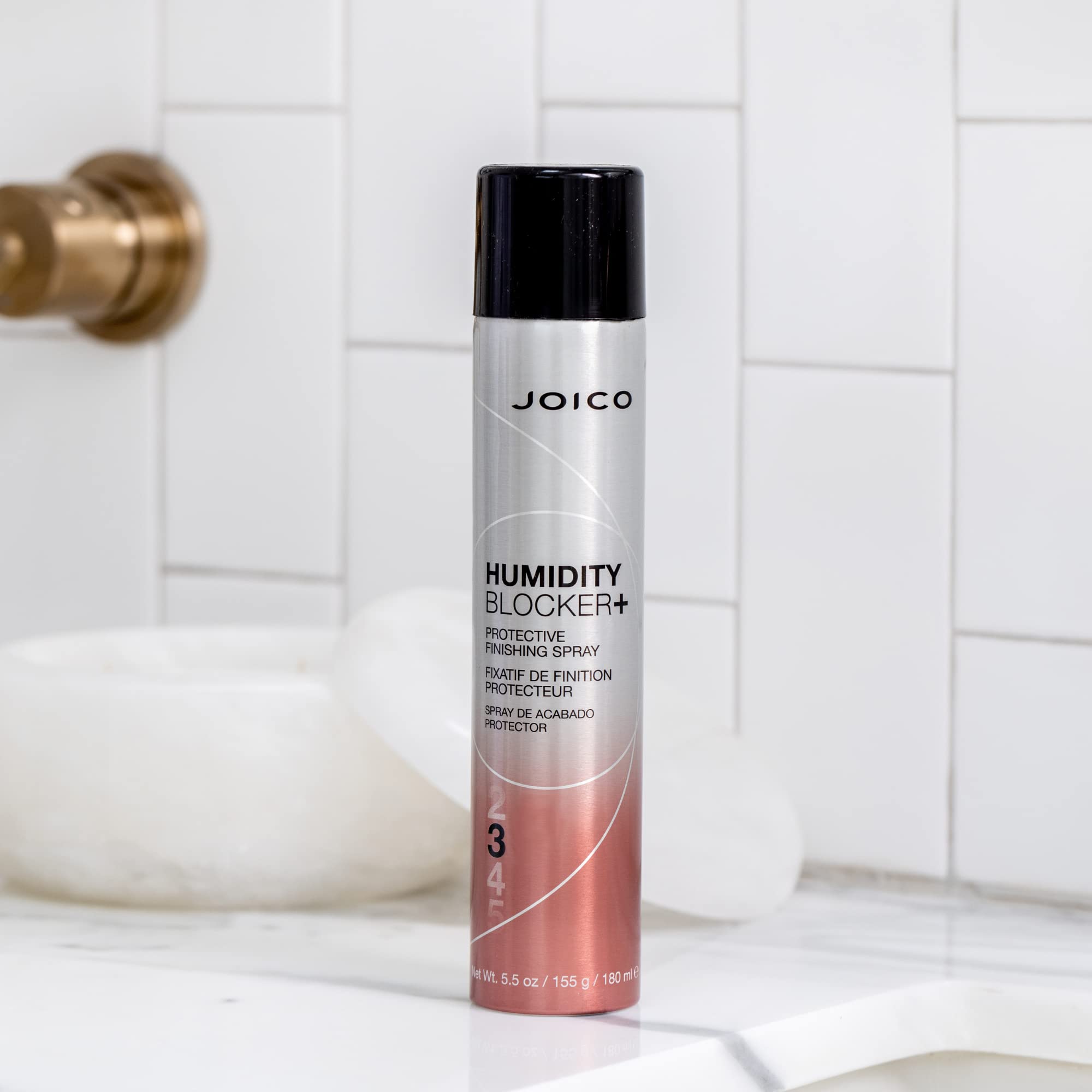 Joico close-up of hair showing glossy finish and smooth texture after use