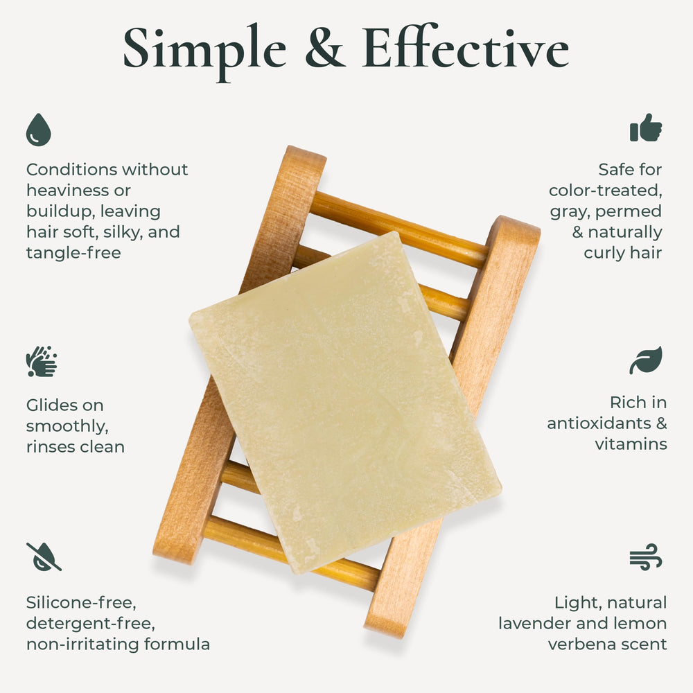 J·R·LIGGETT'S conditioner bar held in hand to show compact size and travel convenience