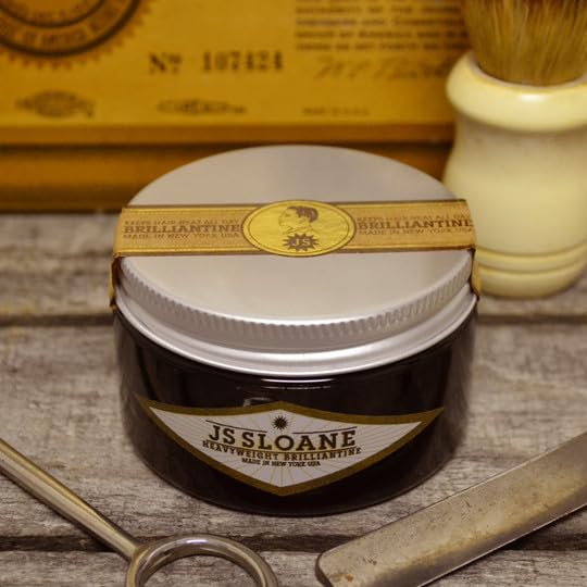 JS Sloane pomade on hands demonstrating easy warming and even spread