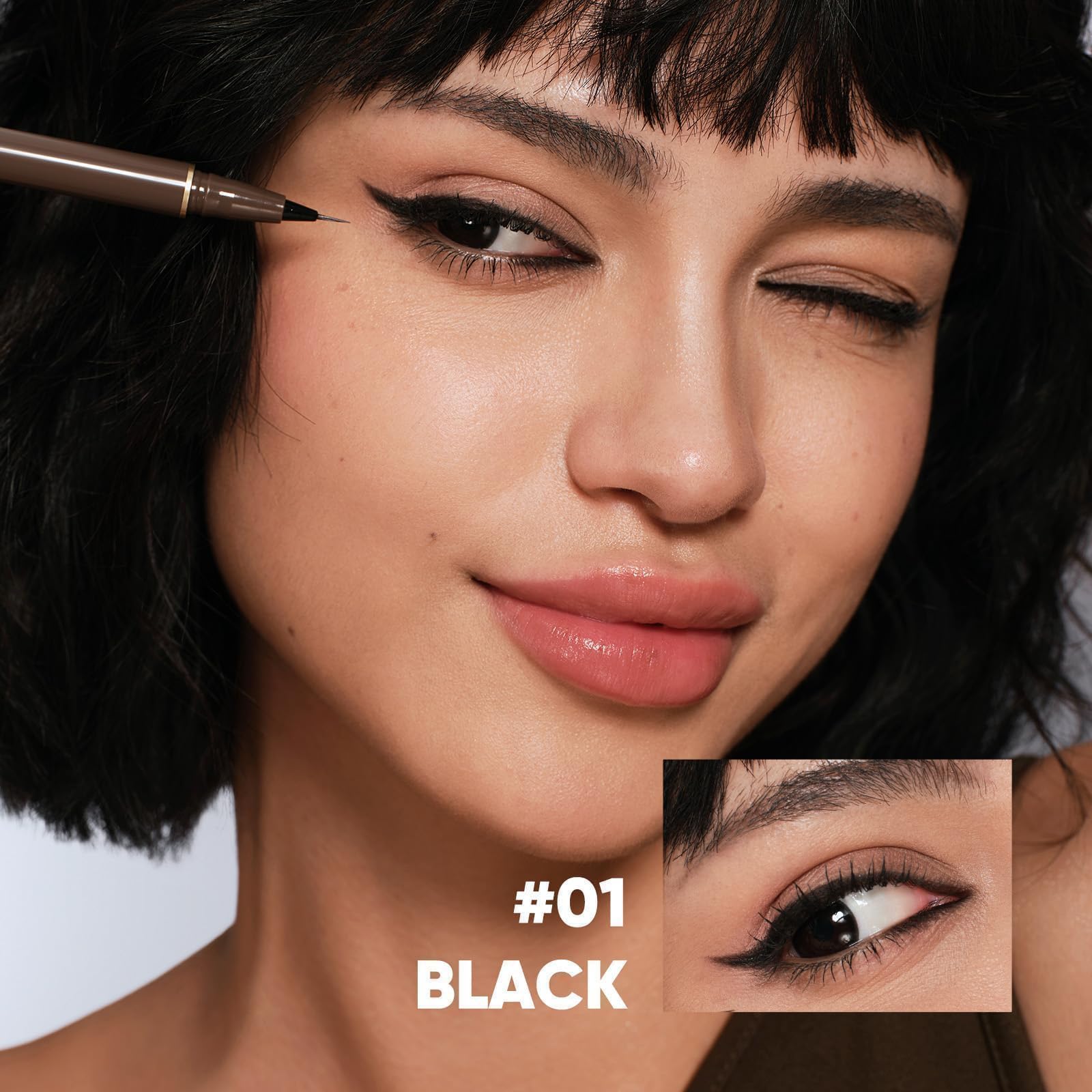 JUDYDOLL black ink stroke swatch showing smooth, high-pigment payoff