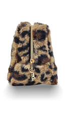 Juicy Couture makeup bag inside suitcase showing compact size and packing convenience