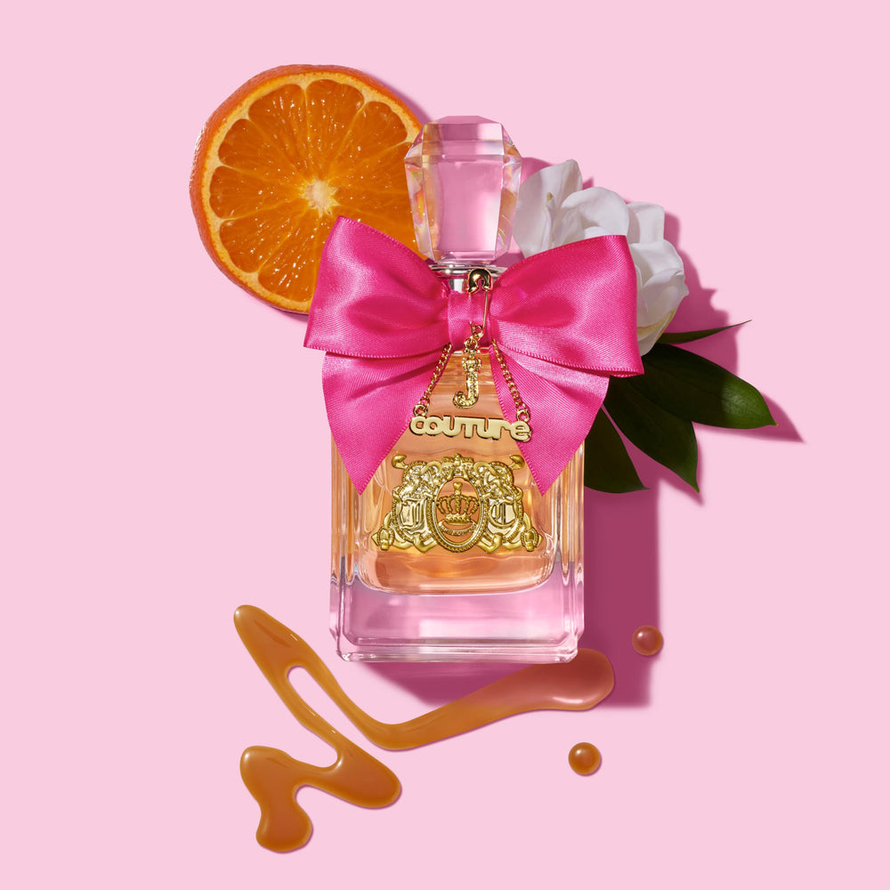 Juicy Couture Viva La Juicy with fresh berries to illustrate the bright fruity top notes