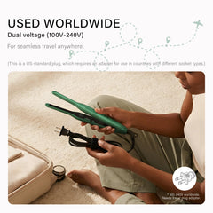 K&K iron in hand demonstrating scale and control for precision styling