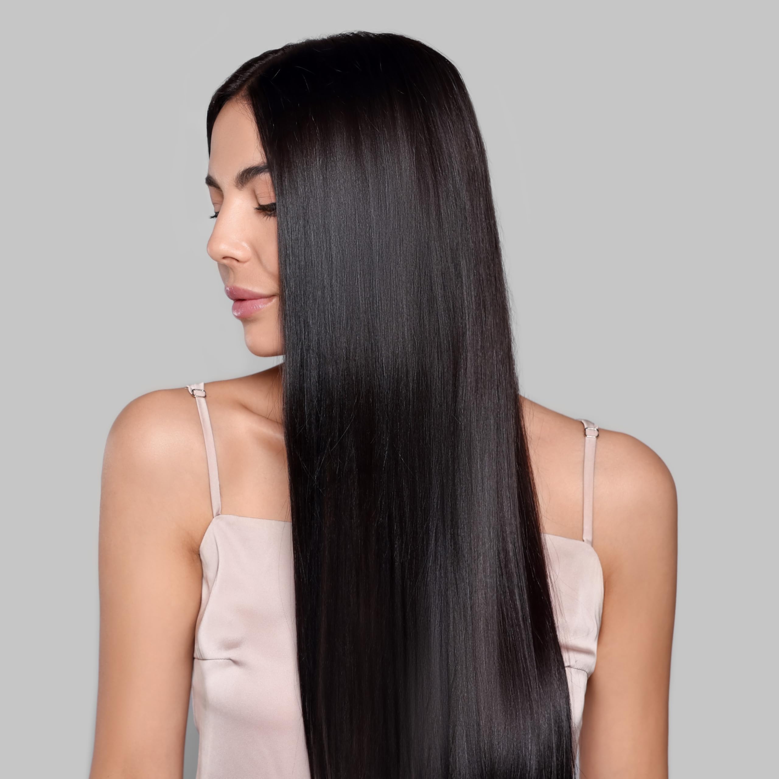 Kachita Spell application in salon with stylist spraying before blowout treatment