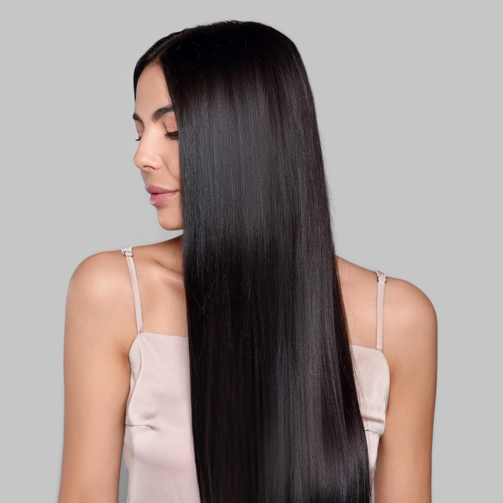 Kachita Spell application in salon with stylist spraying before blowout treatment