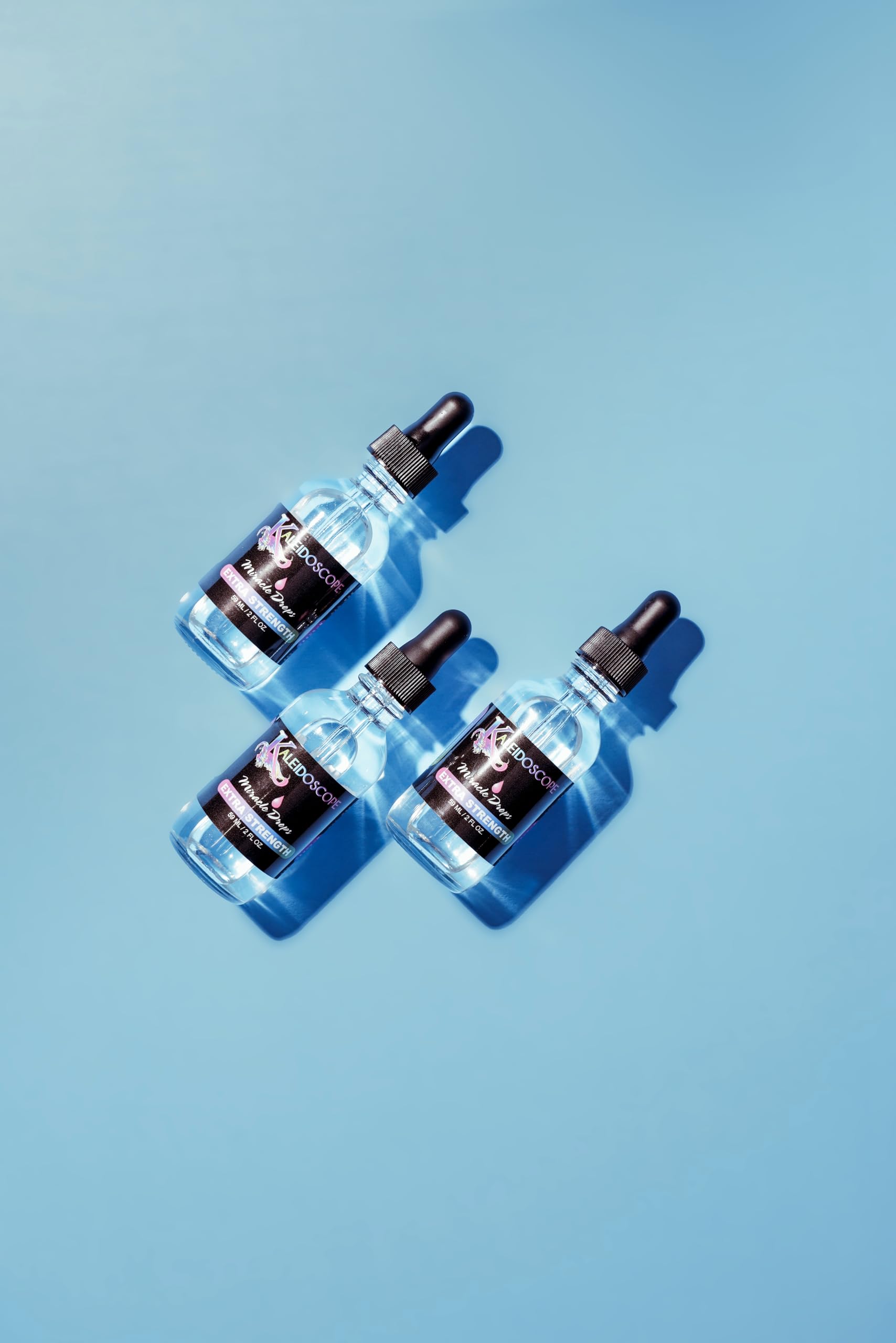 Kaleidoscope Hair Products close-up dropper and oil texture highlighting lightweight absorption benefit