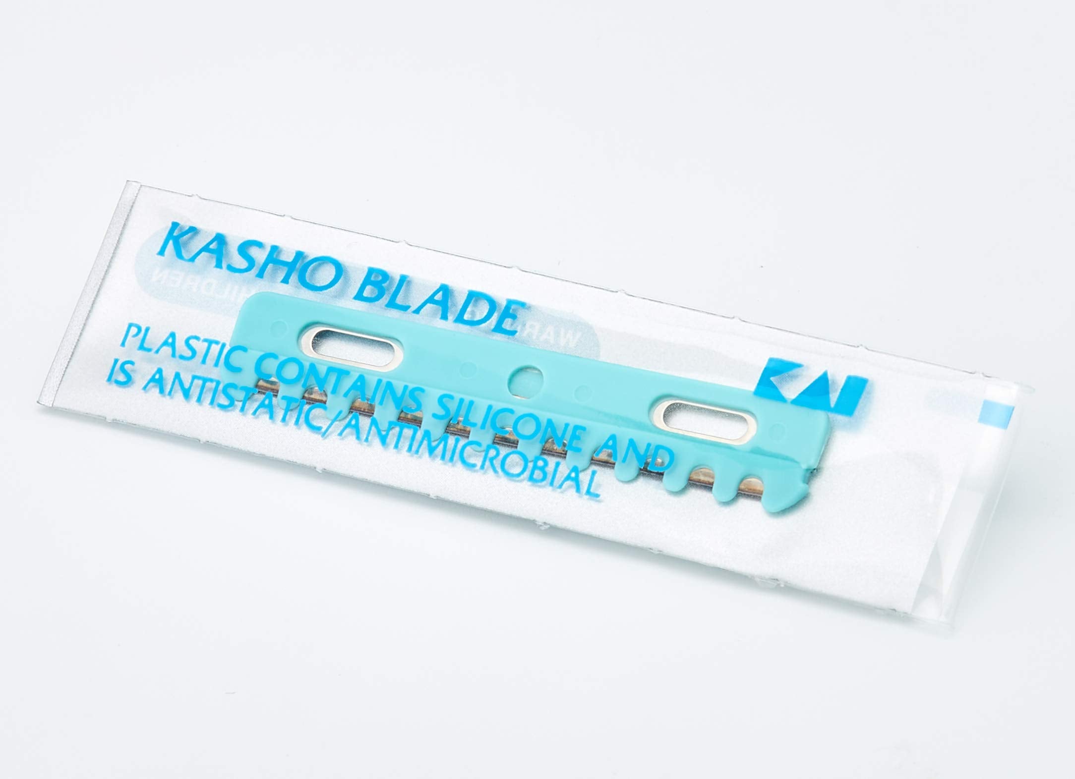 Kasho blades mounted in a razor holder demonstrating safe use