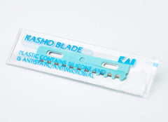 Kasho blades mounted in a razor holder demonstrating safe use