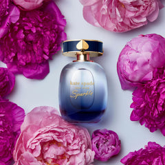 kate spade new york perfume styled in evening setting evoking city-night glamour