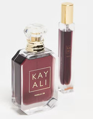 KAYALI Vanilla | 28 travel 10 ml in hand showing portability and ease