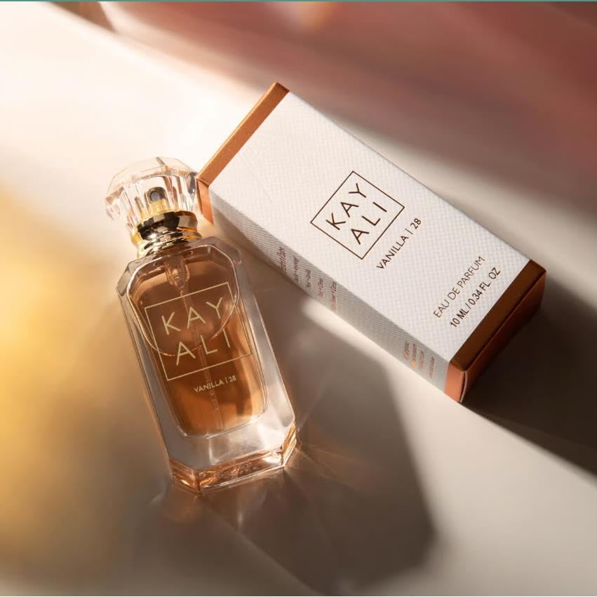 KAYALI travel spray in hand illustrating pocket-ready convenience