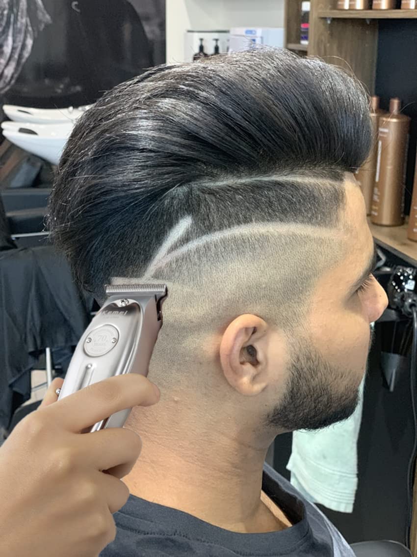 KEMEI in-use trimming a beard demonstrating clean edging and control