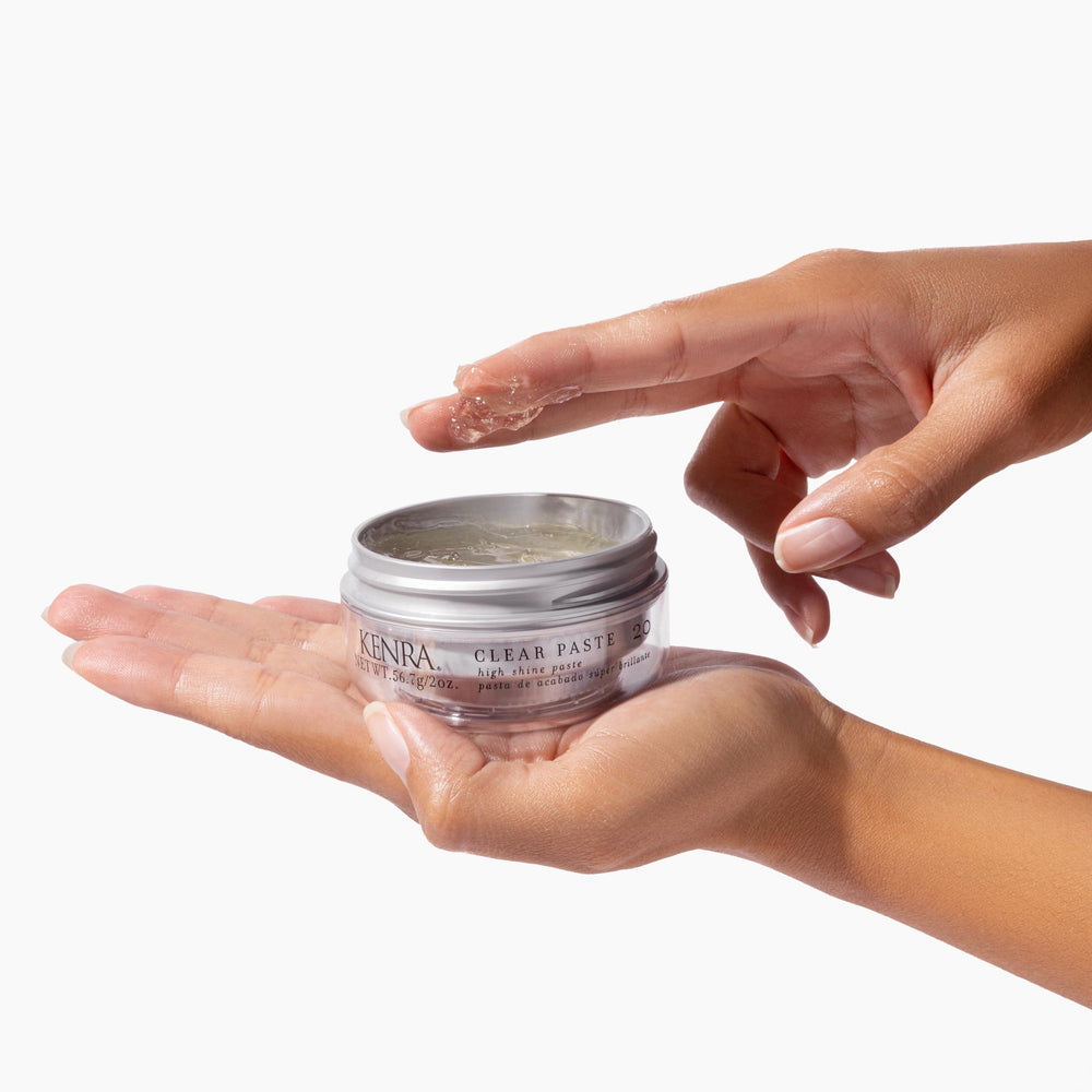 Kenra Clear Paste beside a quarter for scale indicating the compact 2 oz travel-friendly size