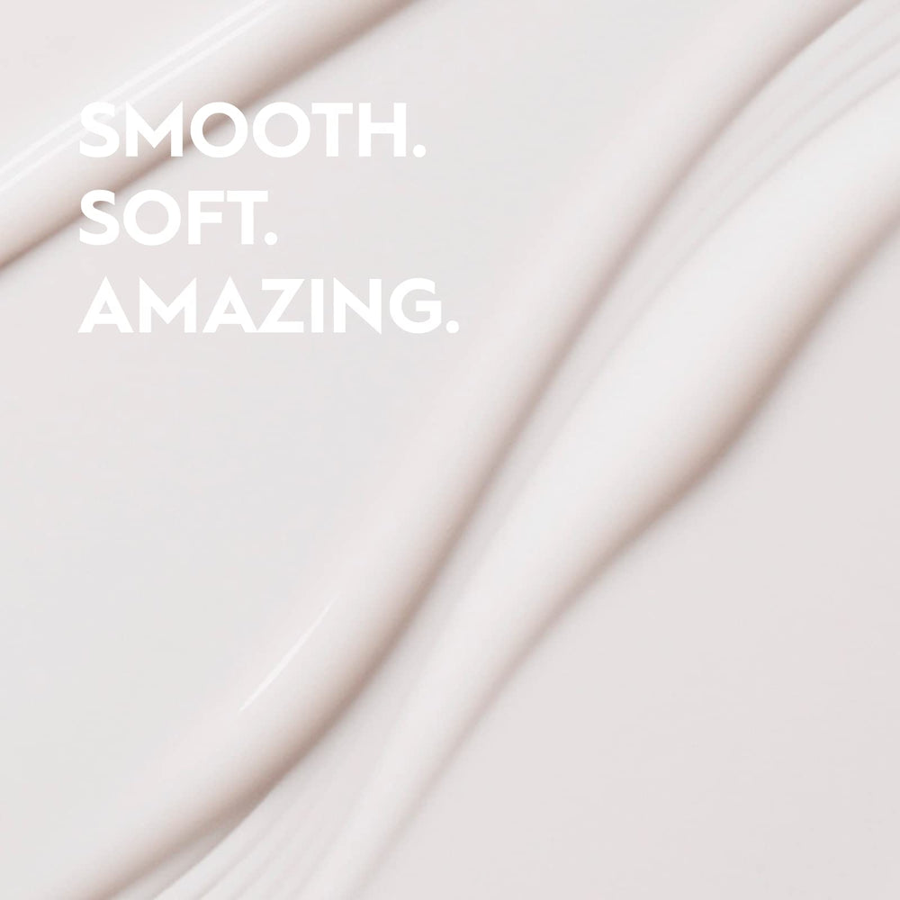 Kerasilk taming balm applied on hands, illustrating spreadability and lightweight feel for styling