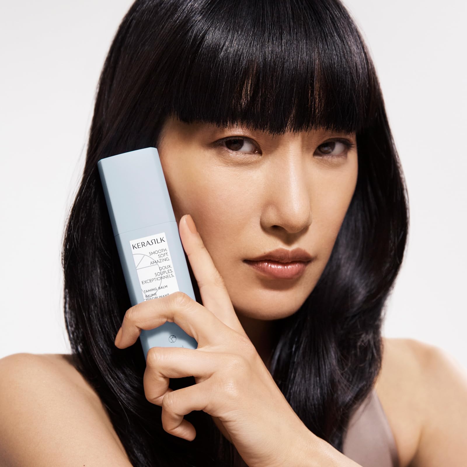 Kerasilk taming balm on towel-dried hair, showing improved manageability for wet-to-dry styling